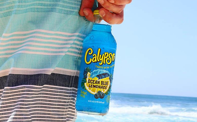 A Hand holding a Calypso Lemonade Drink