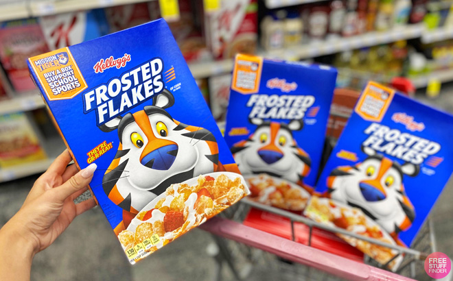 A Person Holding a Box of Kelloggs Frosted Flakes Breakfast Cereal