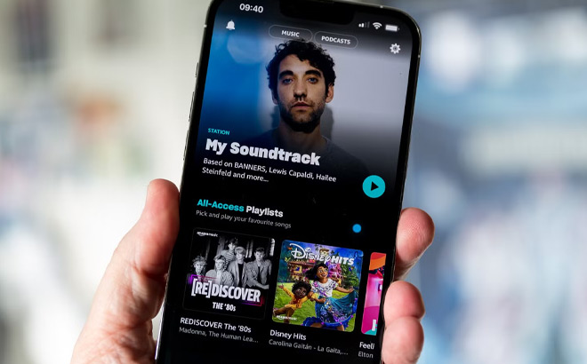A Person Holding a Phone with Amazon Music on the Background