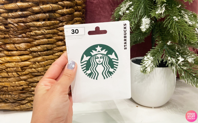 A Person Holding a Starbucks Gift Card