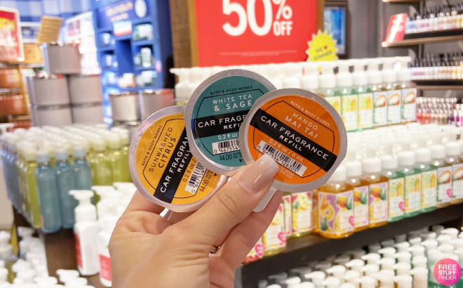 A Person Holding Bath Body Works Car Fragrance Refills