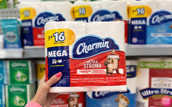 A Person Holding Charmin Ultra Strong Toilet Paper
