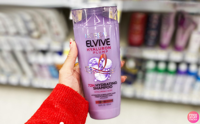 A Person Holding LOreal Paris Elvive Hyaluron Plump Hydrating Shampoo