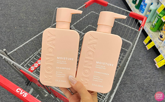 A Person Holding Monday Moisture Shampoo and Conditioner