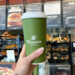 A Person Holding Panera Drink