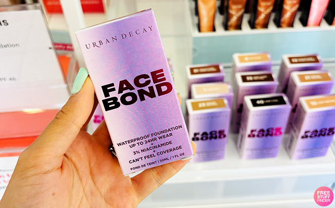 A Person Holding Urban Decay Face Bond Self Setting Waterproof Foundation