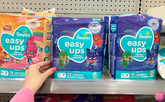 A Person is Holding Pampers Easy Ups Training Underwear Boys Jumbo Size 3T 4T