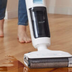 A Person using a Tineco GO H2O Cordless Floor Washer