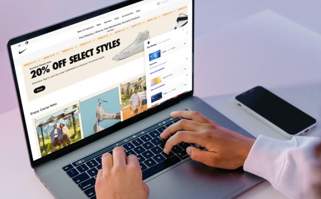 A Person Using Kudos Smart Wallet App on Laptop