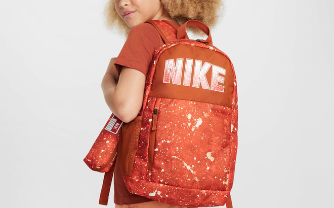 A Person wearing a Nike Big Kids Elemental 20L Backpack