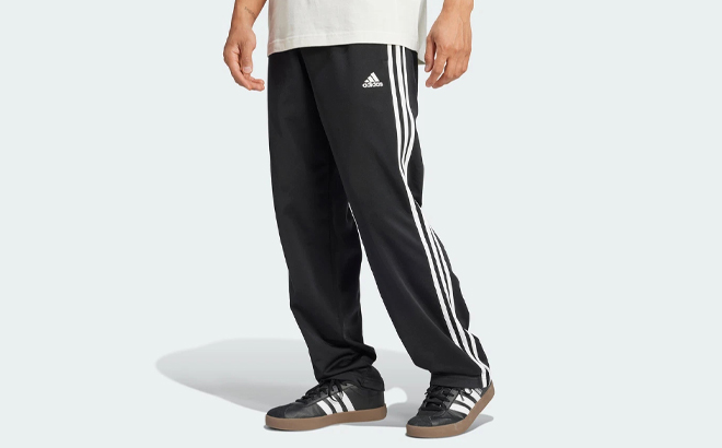 A Person wearing Adidas Mens Track Pants