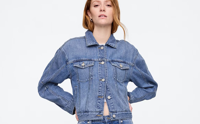A Person Wearing GAP Factory Womens SuperSoft Barrel Sleeve Icon Denim Jacket