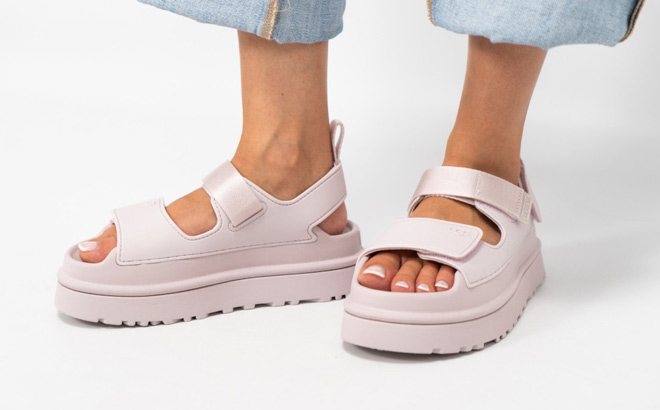 A Person Wearing UGG Womens GoldenGlow Sandals in Bay Fog Color