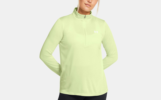 A Person wearing Under Armour Womens Tech Twist Womens Zip Pullover in Retro Green Color