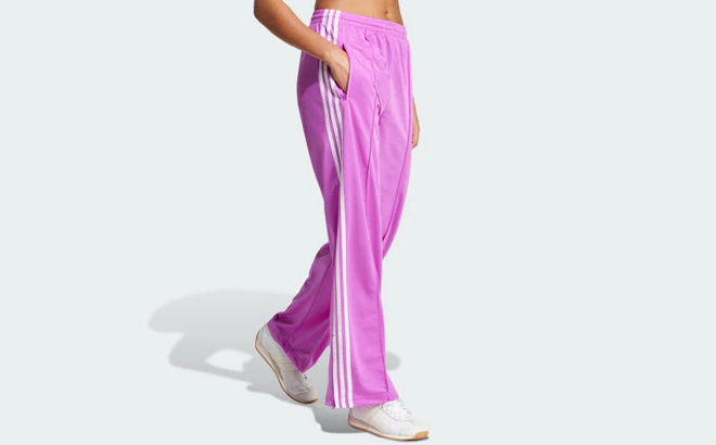 A Woman Wearing Adidas Firebird Loose Track Pants