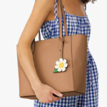A Woman Wearing Kate Spade Outlet Dana Tote