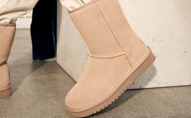 A Woman Wearing Koolaburra by UGG Classic Short Winter Boots
