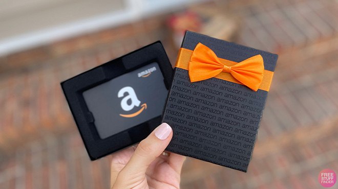 A Hand Holding a Free Amazon Gift Card in a Gift Box