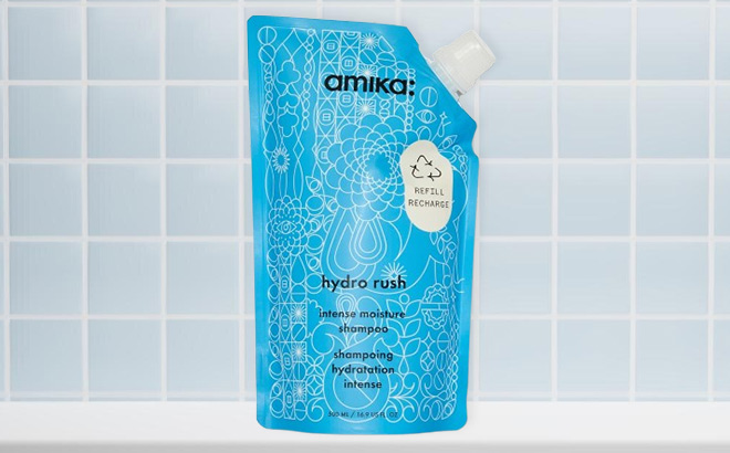 Amika Hydro Rush Intense Moisture Shampoo on the Table