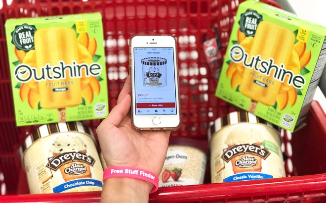 A Hand Holding a Phone with a Circle Offer On It in Front of a Cart