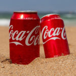Coca Cola Cans on the Beach