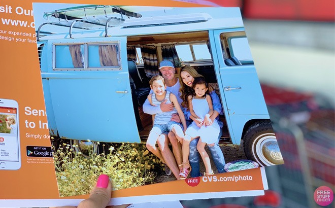 A Person Holding 8x10 Photo Print from CVS