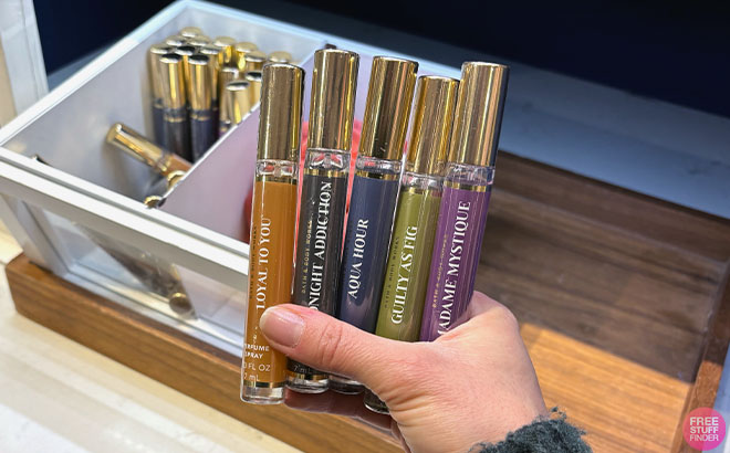Hand holding Bath Body Works Mini Perfume Sprays