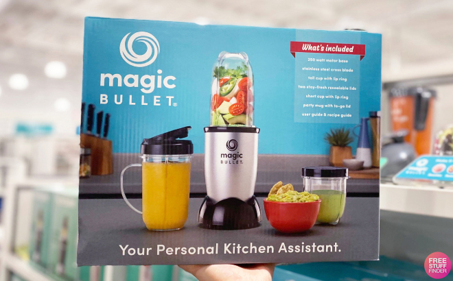 Hand Holding Magic Bullet Single Serve Blender in a Box