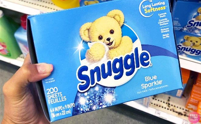 Hand Holding Snuggle Fabric Softener Dryer Sheets
