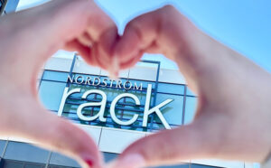 Hands Forming a Heart Shape in Front of Nordstrom Rack