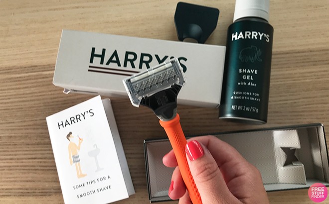 A Hand Holding Harry's Razor