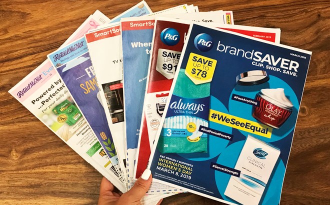 A Hand Holding Coupon Inserts