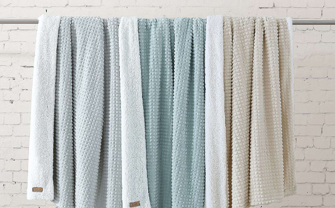 Koolaburra by UGG Sloan Plush Textured Throws hung on a Rack