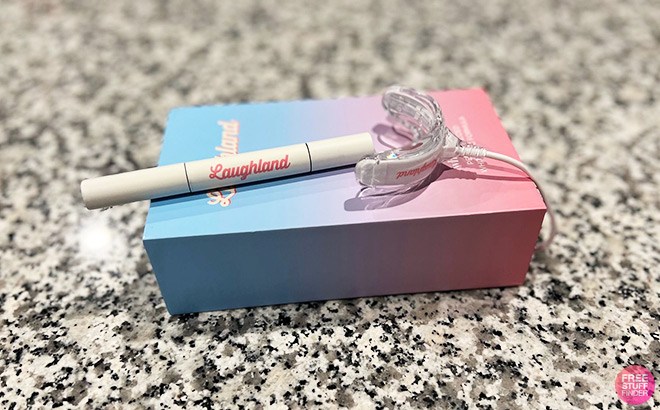 Laughland Gel Applicator and LED Mouthpiece on top of an Ombre Box on a Kitchen Countertop
