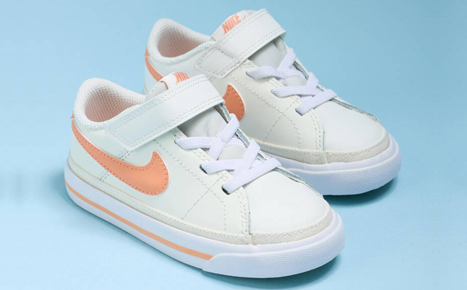 Nike Toddler Court Legacy Sneakers on a Blue Background