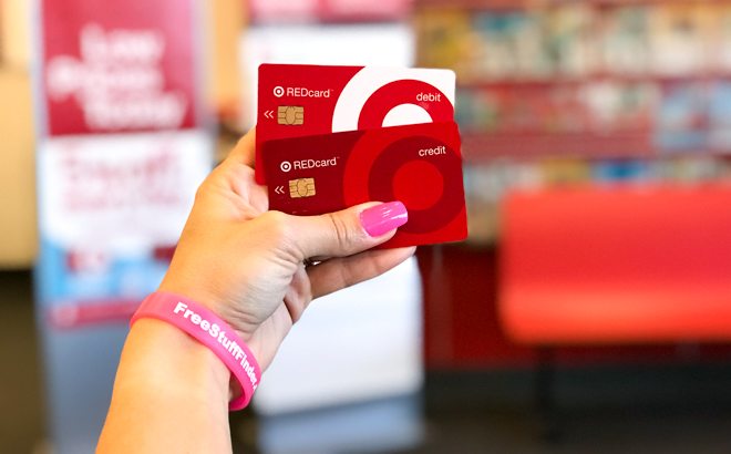 A Hand Holding Target Credit and Debit RedCard