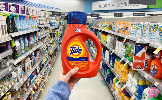 A Hand Holding Tide Detergent at Walgreens