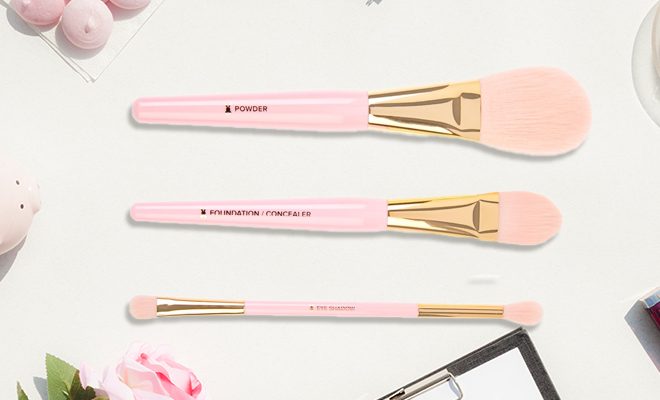 Too Faced 3 piece Makeup Brush Set on a Table