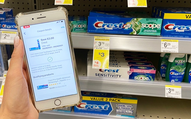 A Hand Holding a Phone with Walgreens App On It