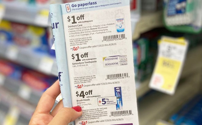 A Hand Holding Walgreens Coupons