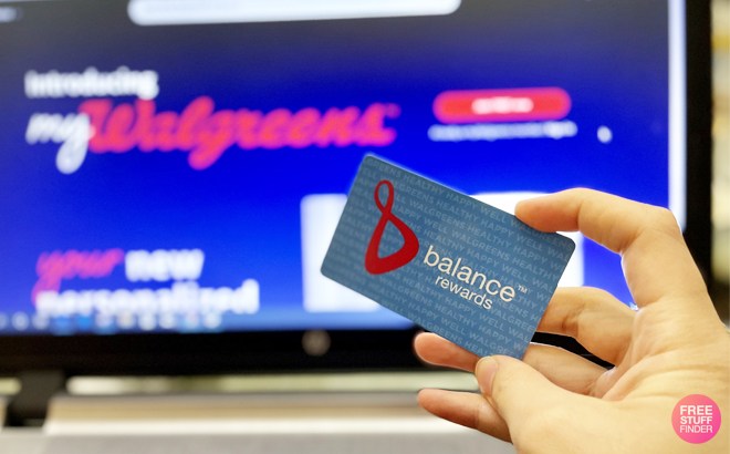 A Hand Holding Balance Rewards Card