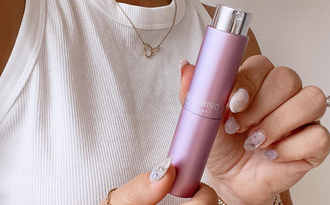 Woman Holding a Scentbird Luxury Perfume Sample